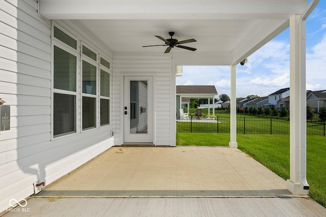 view of patio / terrace featuring ceiling fan and fence