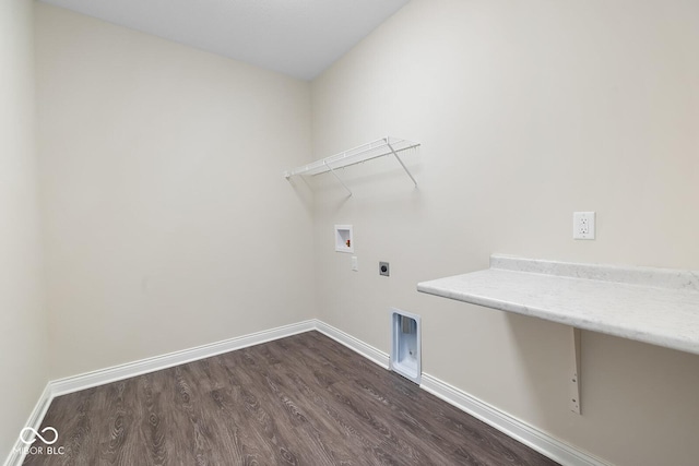 washroom with laundry area, baseboards, dark wood-style floors, hookup for a washing machine, and hookup for an electric dryer