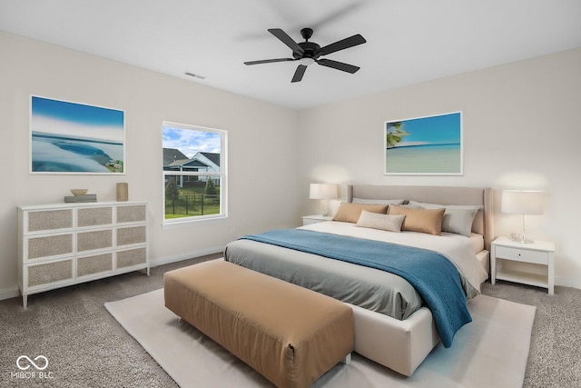 carpeted bedroom with baseboards, visible vents, and ceiling fan