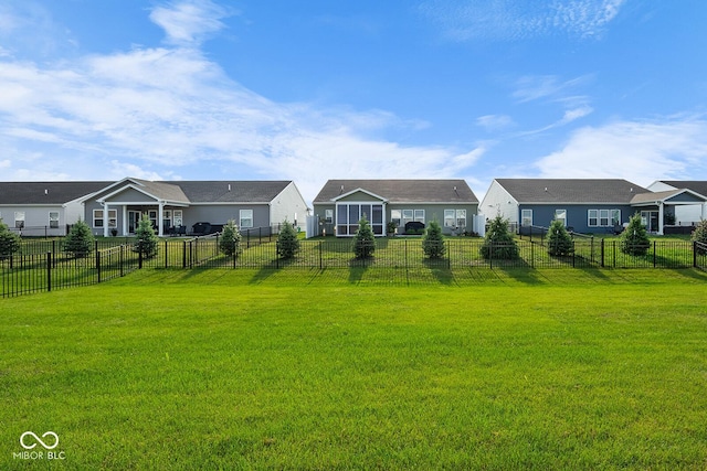 view of yard featuring a fenced backyard and a residential view