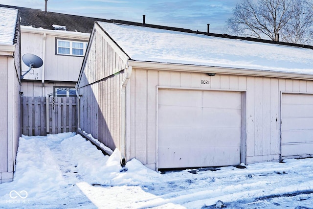 view of snow covered garage