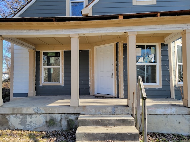 entrance to property featuring a porch