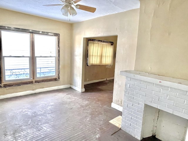 unfurnished living room featuring a fireplace and ceiling fan