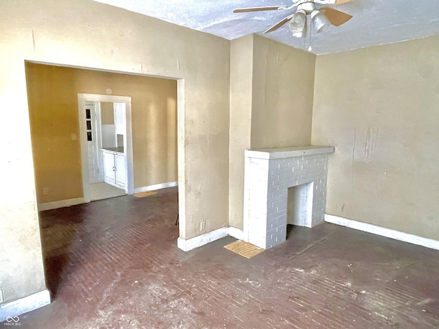 unfurnished living room with ceiling fan