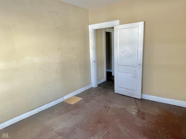 empty room featuring dark hardwood / wood-style flooring