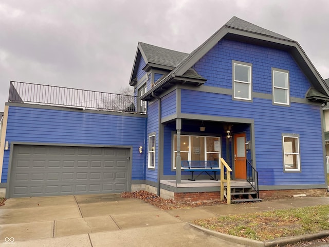 view of front of house featuring a garage and a porch