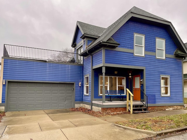 view of front of home with a porch and a garage