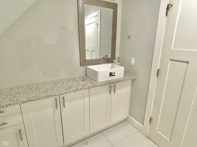 bathroom with tile patterned floors and vanity