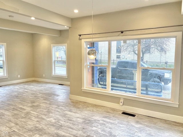 unfurnished dining area featuring light hardwood / wood-style flooring