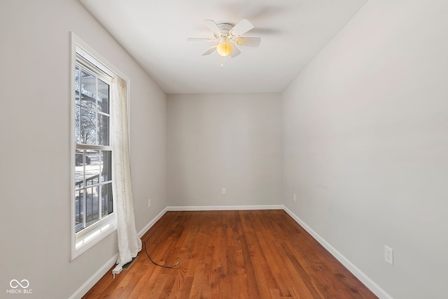 unfurnished room featuring ceiling fan and wood-type flooring