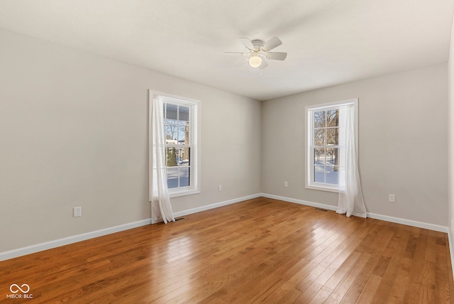 unfurnished room featuring hardwood / wood-style floors and ceiling fan