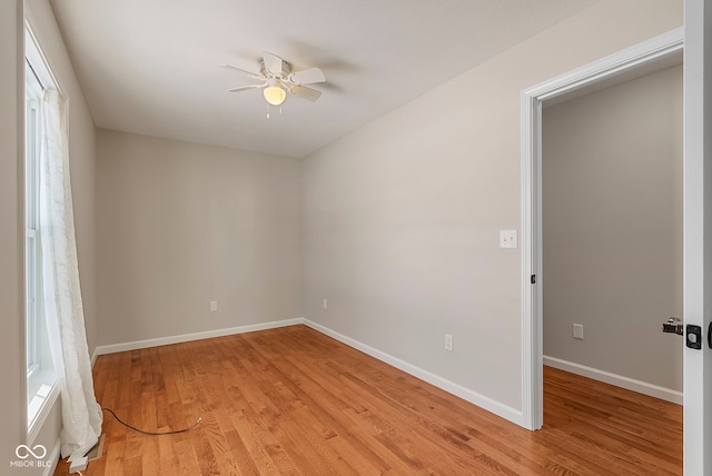 spare room with light hardwood / wood-style flooring and ceiling fan