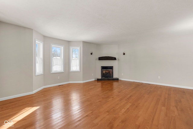 unfurnished living room with light hardwood / wood-style floors