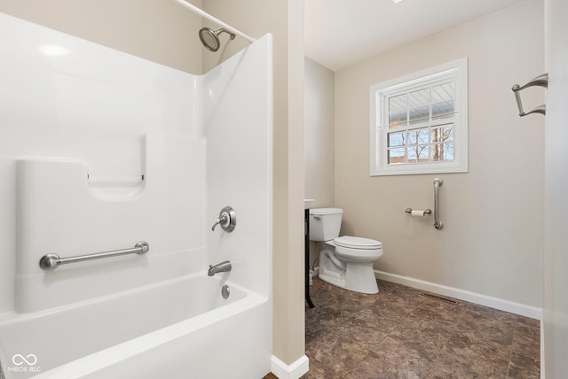 bathroom with bathtub / shower combination and toilet