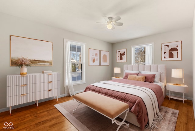 bedroom featuring radiator, ceiling fan, and wood-type flooring