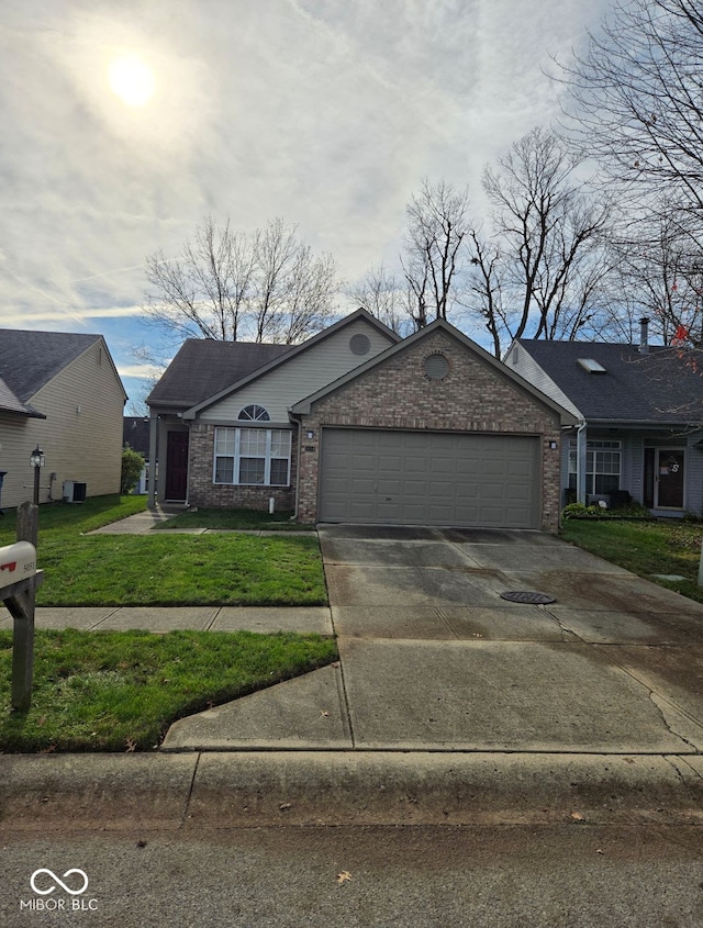 view of front of home with a garage and a front yard