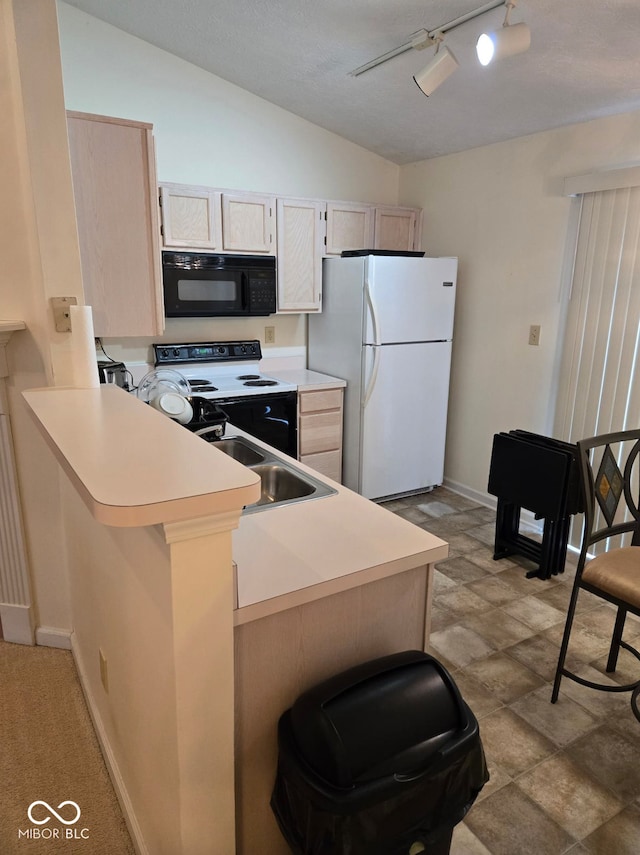 kitchen featuring kitchen peninsula, light brown cabinets, white appliances, and sink