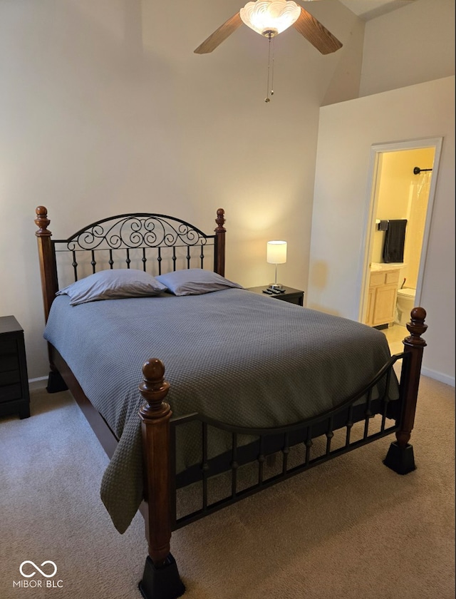 bedroom with connected bathroom, ceiling fan, and carpet floors