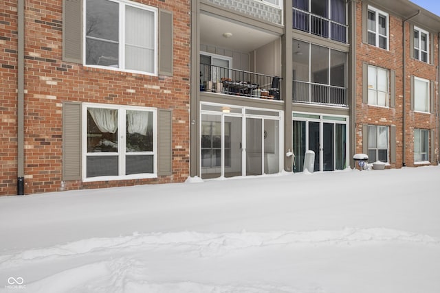 view of snow covered house