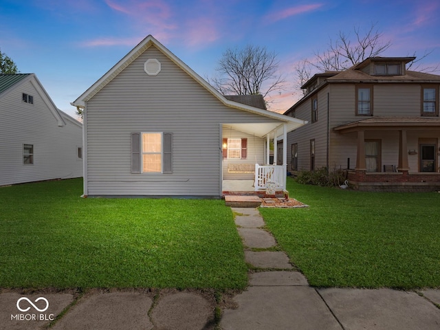 view of front of house featuring a porch and a lawn