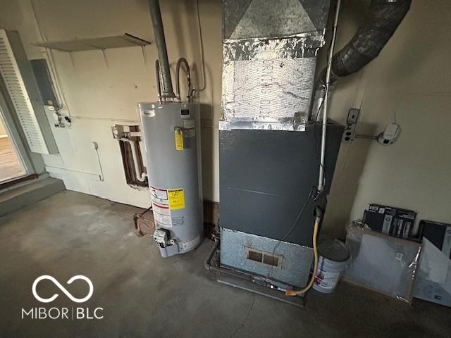 utility room featuring gas water heater