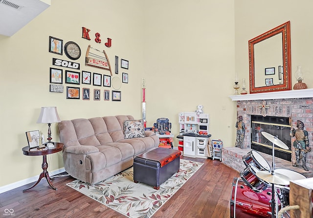 living room with a fireplace and hardwood / wood-style flooring