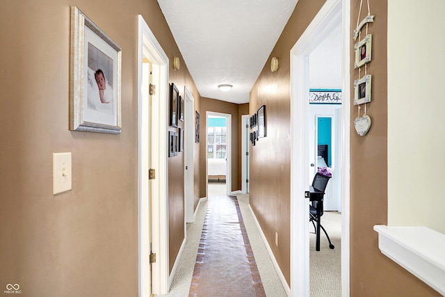 corridor featuring carpet flooring