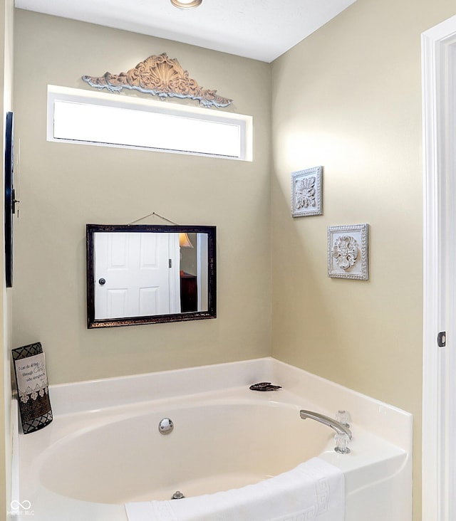 bathroom featuring a washtub