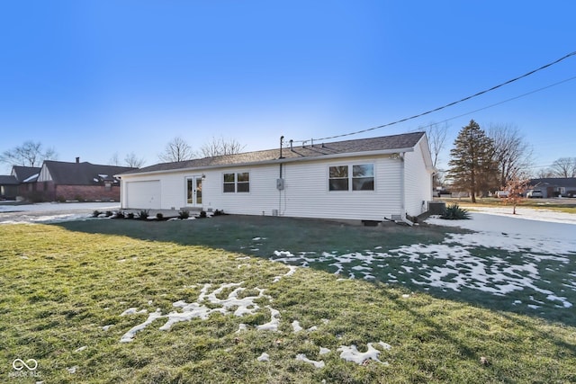 back of house with cooling unit and a yard