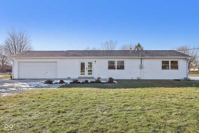 view of front of house featuring a garage and a front lawn