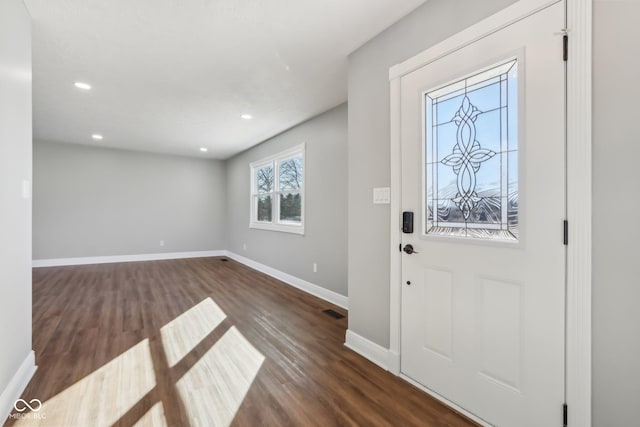 foyer entrance featuring dark wood-type flooring