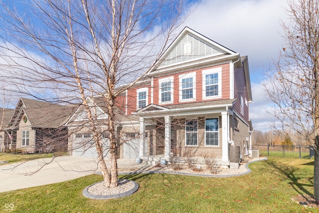 view of front of house featuring cooling unit, a front lawn, and a garage