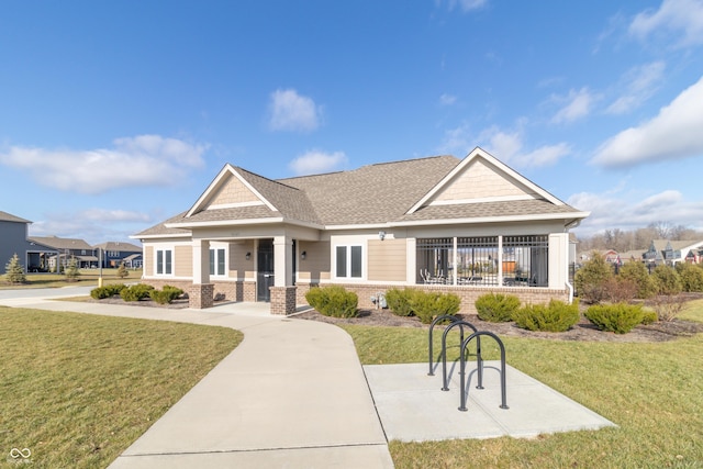 craftsman inspired home with a front yard