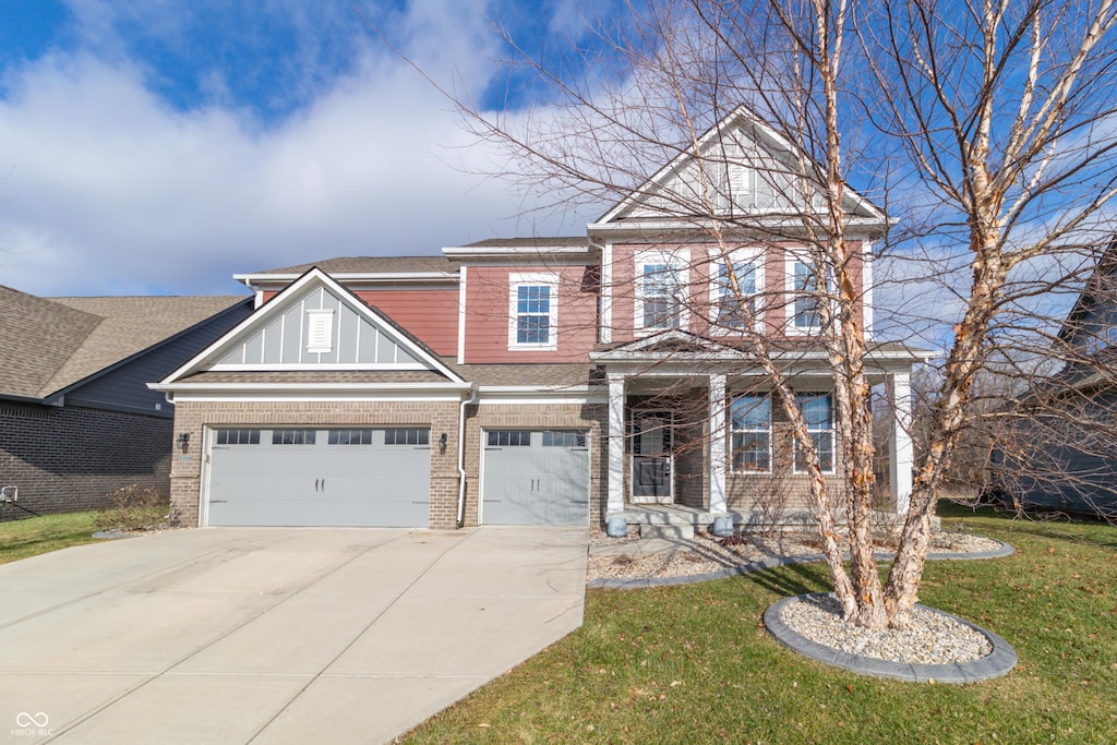 view of front facade featuring a garage and a front yard