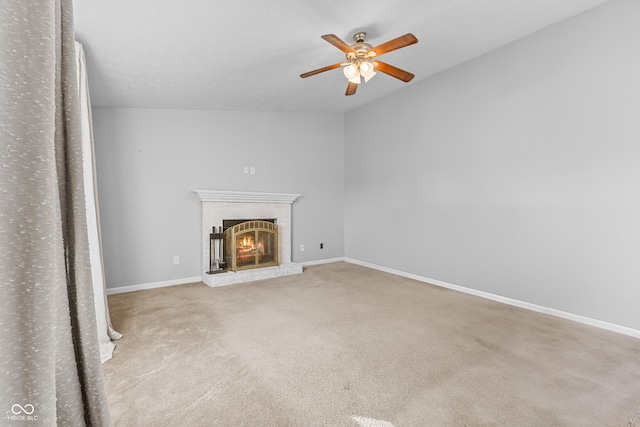 unfurnished living room with light carpet, a fireplace, ceiling fan, and lofted ceiling