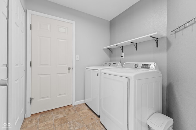 laundry area featuring washing machine and clothes dryer