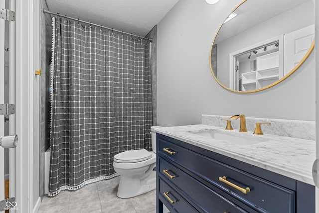 full bathroom with shower / bath combo, vanity, tile patterned floors, toilet, and a textured ceiling