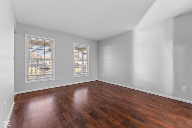 empty room featuring dark hardwood / wood-style floors