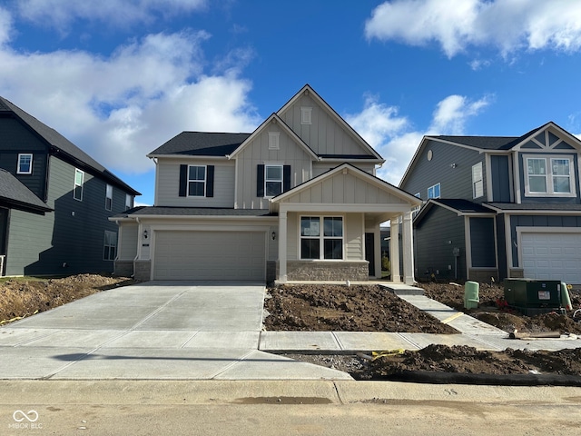 view of front of home with a porch and a garage