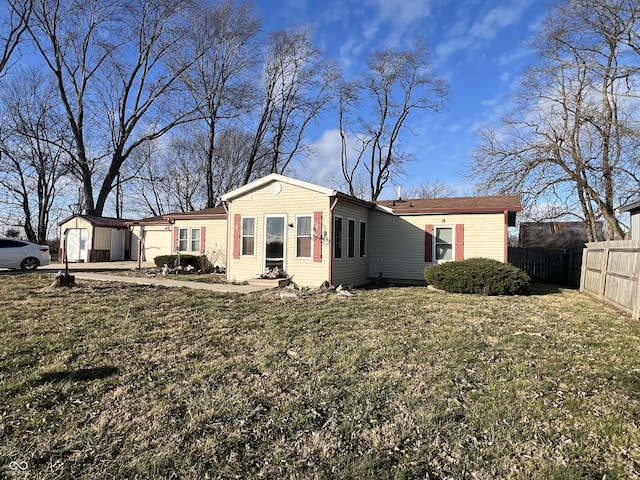 exterior space featuring a front lawn and a garage