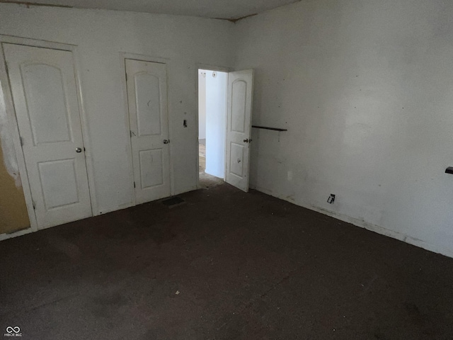 unfurnished bedroom with lofted ceiling