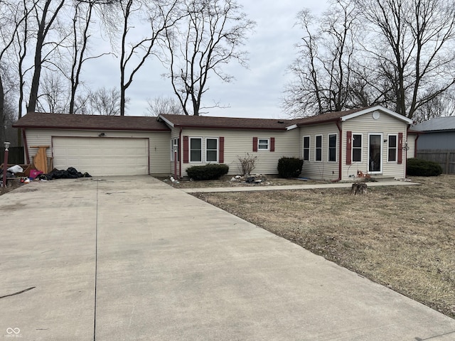 single story home with a front yard and a garage