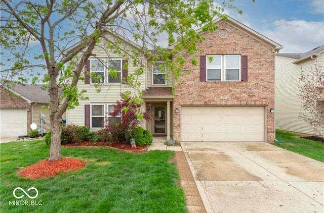 view of front of property with a front lawn and a garage