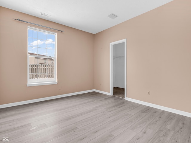 unfurnished room featuring light hardwood / wood-style flooring