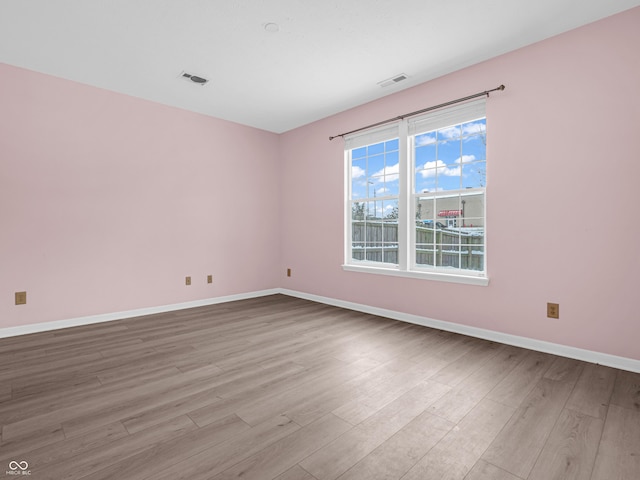 unfurnished room featuring light wood-type flooring