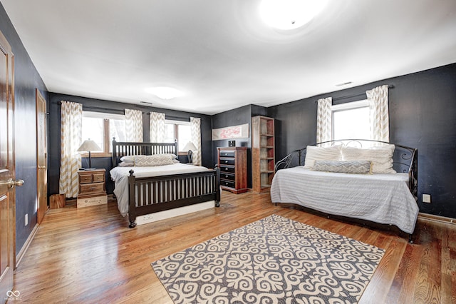 bedroom with hardwood / wood-style flooring