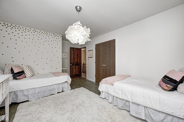 bedroom featuring radiator and an inviting chandelier