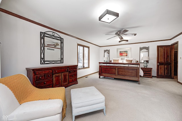 carpeted bedroom with ceiling fan and ornamental molding