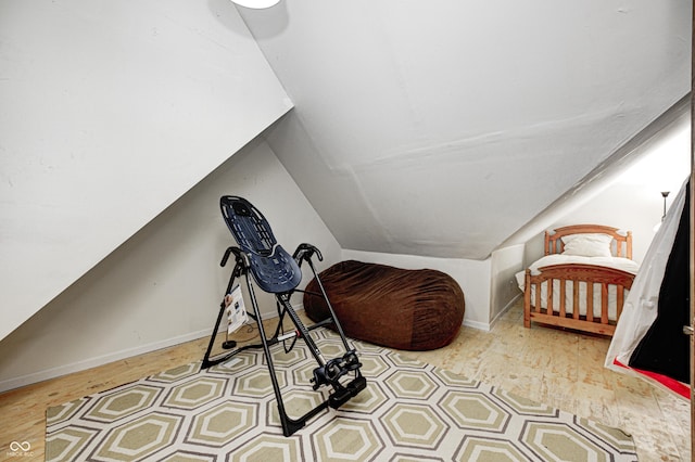 sitting room featuring vaulted ceiling and light hardwood / wood-style flooring