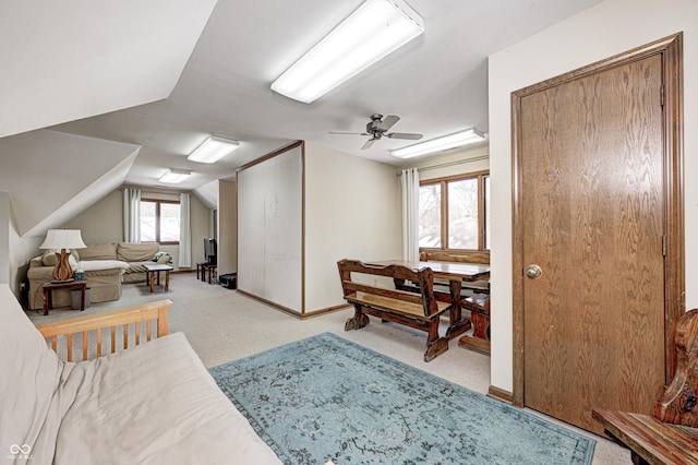 interior space with ceiling fan and light colored carpet